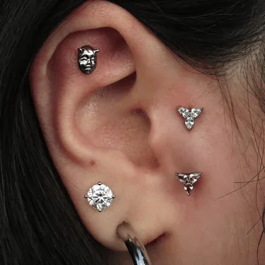 Gold jewelry at Synergy Body Art in Lakewood, Colorado